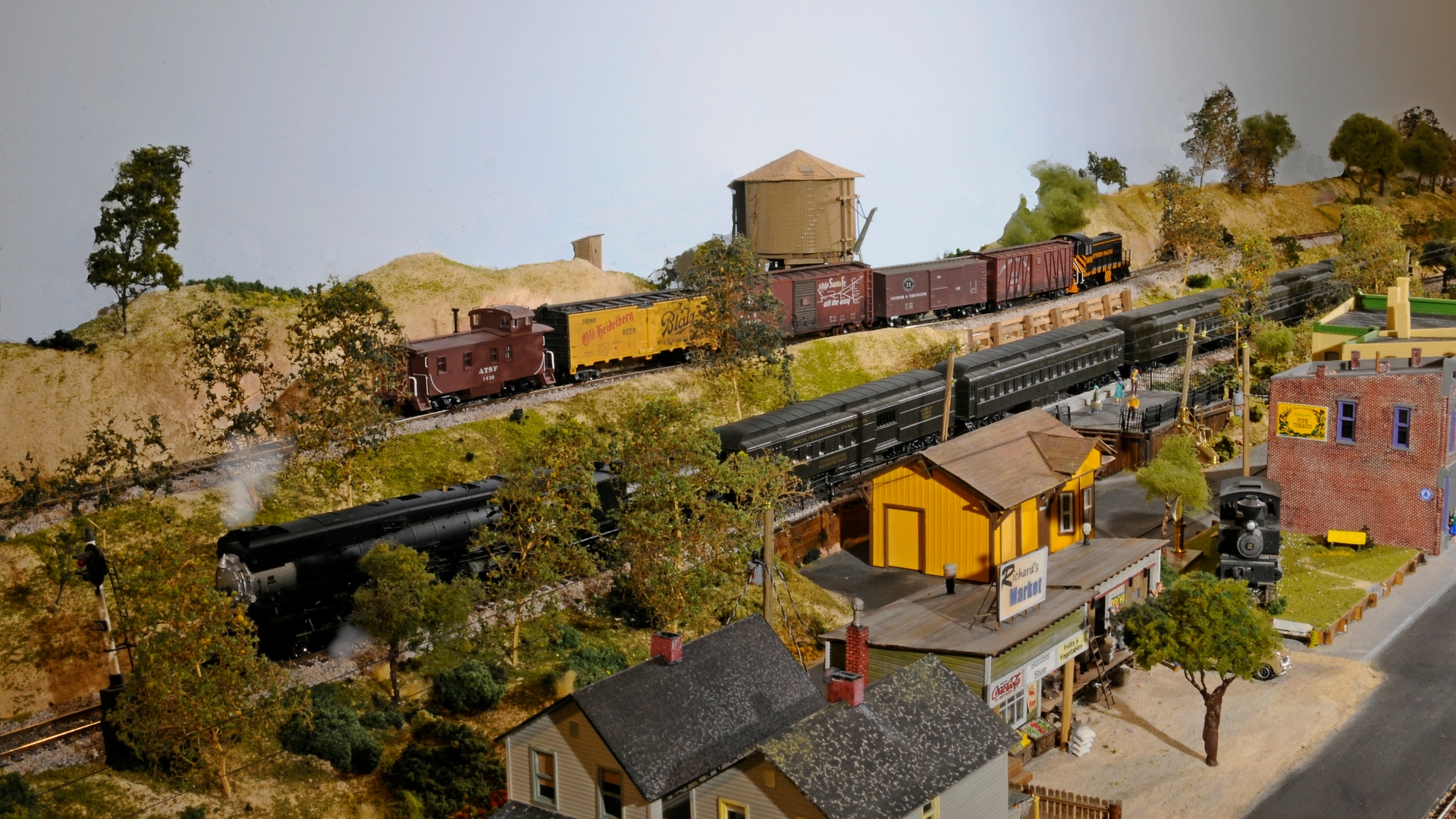 SP Mountain #4389 waits for tourists boarding the excursion while SP #1469 an ALCO S4 returns a short run of freight cars to the yard.